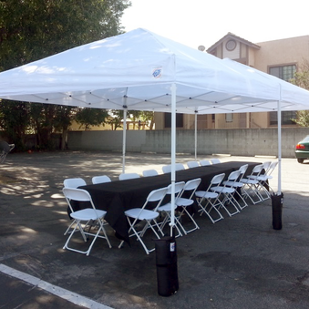 10x10-pop-up-canopy-white-folding-chairs-6ft-tables-rectangular-black-linen-tablecloth-party-event-rentals